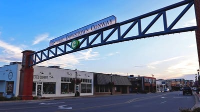 The Downtown Conway sign over Oak Street.